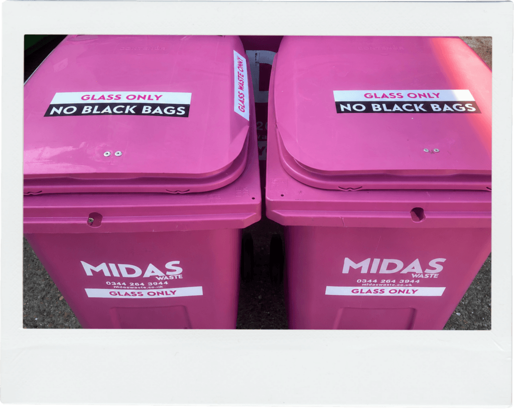 Two Midas Waste wheelie bins with 'Glass Only' labels