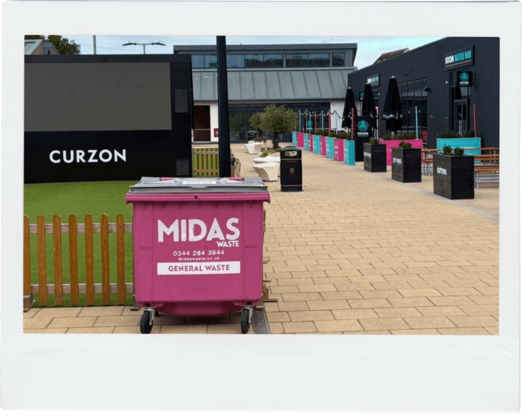 A Midas Waste wheelie bin in front of the outdoor Curzon cinema screen in Canterbury, Kent