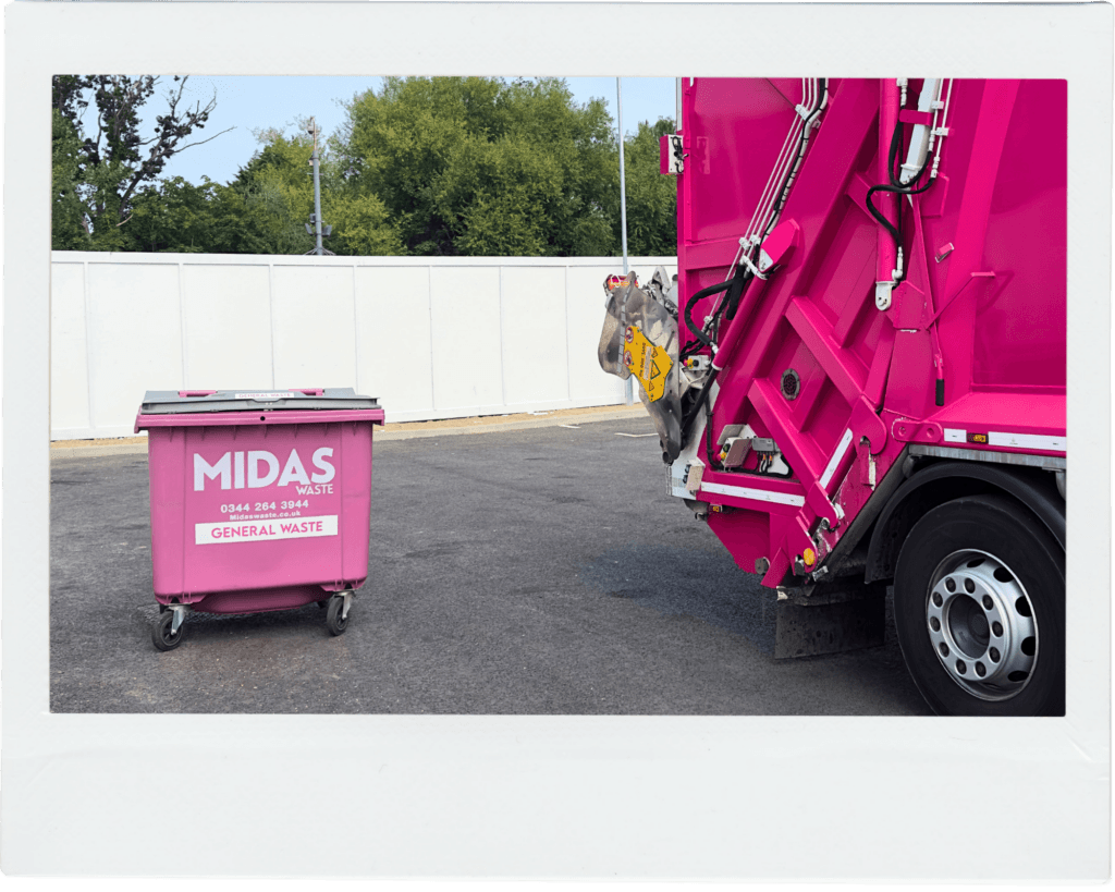 A Midas Waste wheelie bin in a Canterbury retail business car park alongside a Midas Waste dustcart